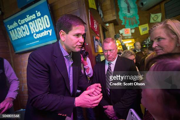 Republican presidential candidate Sen. Marco Rubio greets guests during a campaign rally at the Water Dog Grill on January 13, 2016 in Mount...