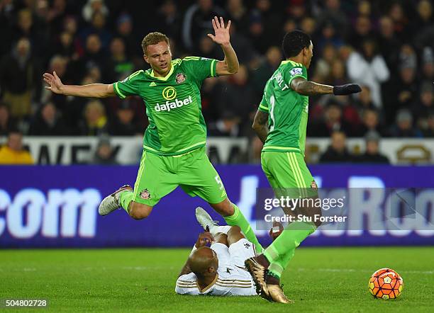 Andre Ayew of Swansea City is fouled by Wes Brown of Sunderland in the area resutling in a penalty during the Barclays Premier League match between...