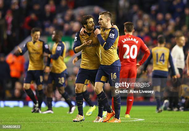 Aaron Ramsey of Arsenal celebrates scoring his team's first goal with his team mate Mathieu Flamini during the Barclays Premier League match between...