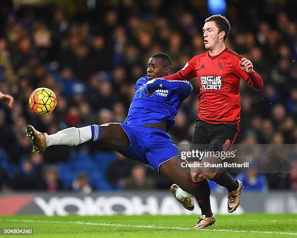 Kurt Zouma of Chelsea and Craig Gardner of West Bromwich Albion compete for the ball during the Barclays Premier League match between Chelsea and...