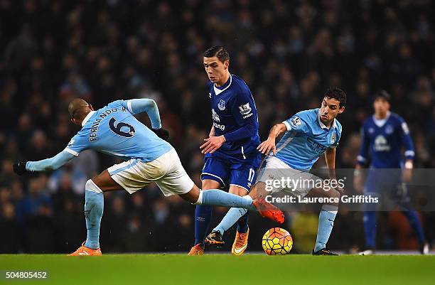 Muhamed Besic of Everton competes for the ball against Fernando and Jesus Navas of Manchester City during the Barclays Premier League match between...