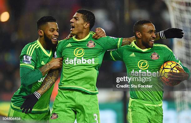 Patrick van Aanholt of Sunderland celebrates scoring his team's second goal with his team mates Jeremain Lens and Jermain Defoe during the Barclays...