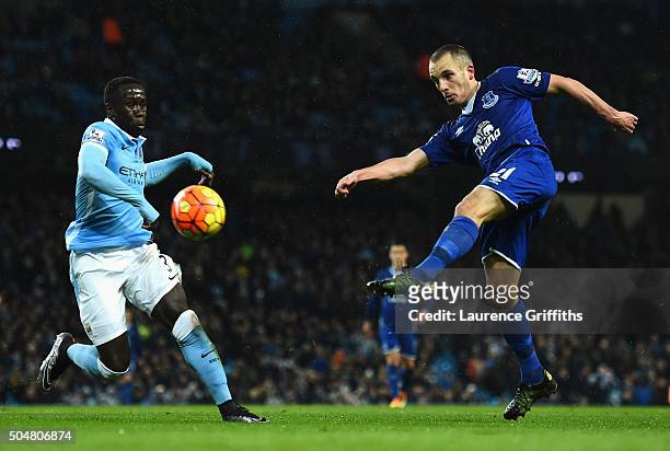 Leon Osman of Everton and Bacary Sagna of Manchester City compete for the ball during the Barclays Premier League match between Manchester City and...