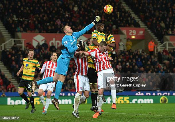 Jack Butland of Stoke City punches the ball during the Barclays Premier League match between Stoke City and Norwich City at the Britannia Stadium on...