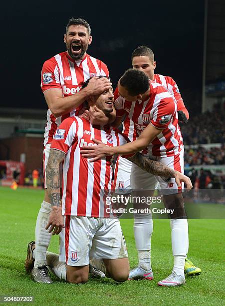 Joselu of Stoke City celebrates scoring his team's second goal with his team mates during the Barclays Premier League match between Stoke City and...