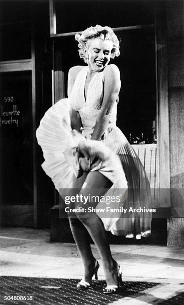 Marilyn Monroe standing over a subway grate with her white dress blowing in 1954 during the filming of "The Seven Year Itch" in Los Angeles,...