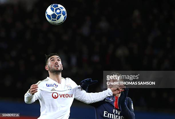 Lyon's French midfielder Jordan Ferri heads the ball nex to Paris Saint-Germain's Italian midfielder Marco Verratti during the French League Cup...