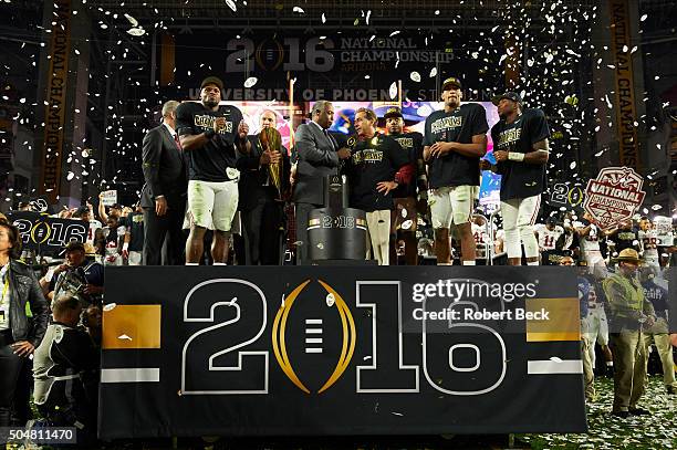 Playoff National Championship: Alabama head coach Nick Saban victorious on podium during media interview with ESPN announcer John Saunders after...