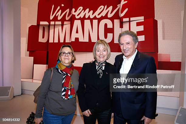 Martine Monteil standing between her collaborator Marie-Louise Boulanger and presenter of the show Michel Drucker attend the 'Vivement Dimanche'...