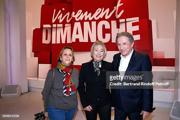 Martine Monteil standing between her collaborator Marie-Louise Boulanger and presenter of the show Michel Drucker attend the 'Vivement Dimanche'...