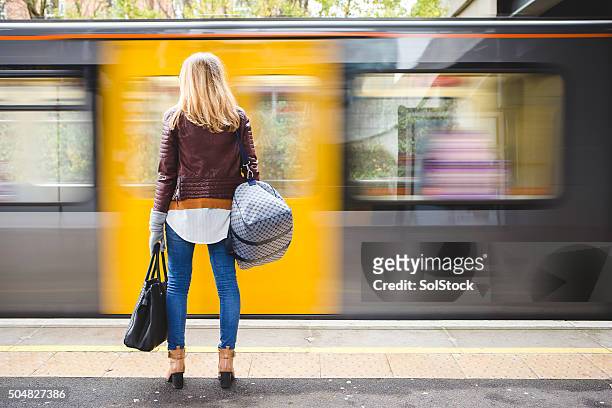 waiting for the train - railroad station stock pictures, royalty-free photos & images