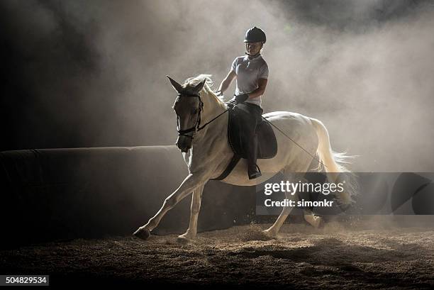 woman riding horse - horse riding stockfoto's en -beelden