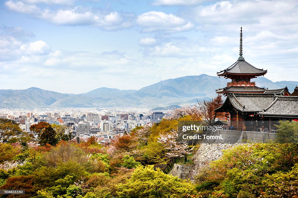 Kiyomizu-dera Temple Buildings with Kyoto, Japan City Skyline and Mountains