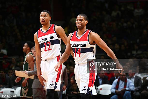 Otto Porter Jr. #22 of the Washington Wizards and Gary Neal of the Washington Wizards stand on the court during the game against the Milwaukee Bucks...