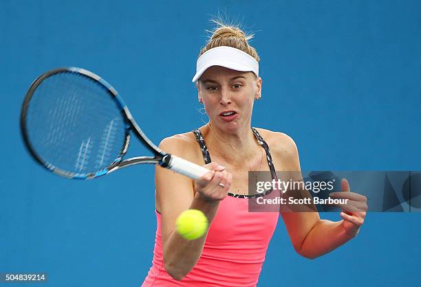 Naomi Broady of Great Britain plays a forehand in his her match against Alize Lim of France during the first round of 2016 Australian Open Qualifying...