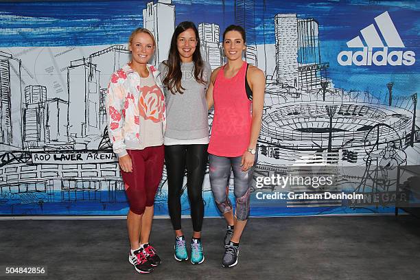 Caroline Wozniacki of Denmark, Ana Ivanovic of Serbia and Andrea Petkovic of Germany pose during the adidas ACE Case Launch at Crown Entertainment...
