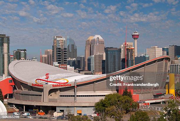 saddledome with calgary skyline - calgary saddledome stock pictures, royalty-free photos & images