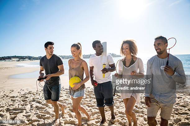 group of people playing sports - beach cricket stock pictures, royalty-free photos & images
