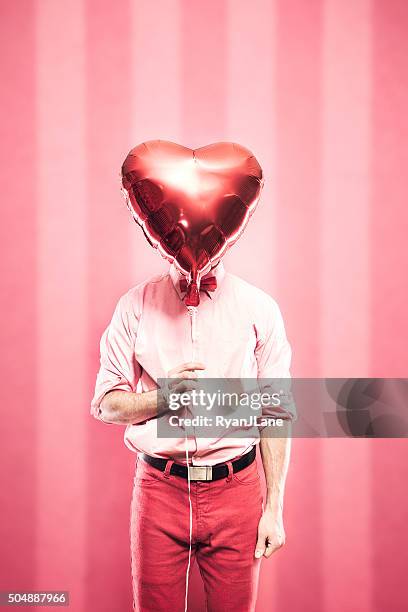 nerd with valentines day gift - hidden patterns stock pictures, royalty-free photos & images