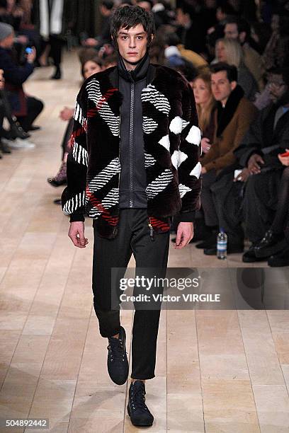 Model walks the runway at the Burberry show during The London Collections Men AW16 at Kensington Gardens on January 11, 2016 in London, England.