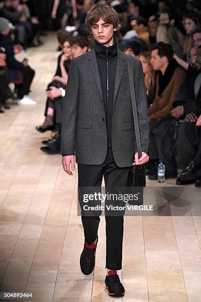 Model walks the runway at the Burberry show during The London Collections Men AW16 at Kensington Gardens on January 11, 2016 in London, England.