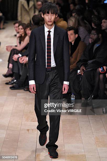 Model walks the runway at the Burberry show during The London Collections Men AW16 at Kensington Gardens on January 11, 2016 in London, England.