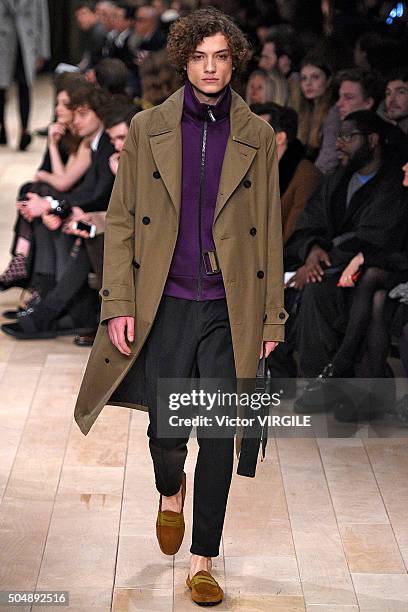 Model walks the runway at the Burberry show during The London Collections Men AW16 at Kensington Gardens on January 11, 2016 in London, England.