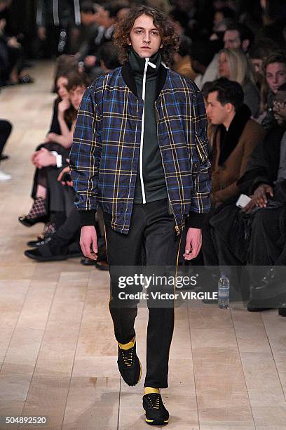 Model walks the runway at the Burberry show during The London Collections Men AW16 at Kensington Gardens on January 11, 2016 in London, England.