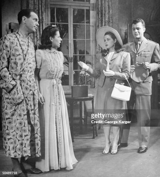 Harvey Stephens , Ruth Gordon , Beatrice Pearson and Thomas Seidel acting in production of Over Twenty-One.