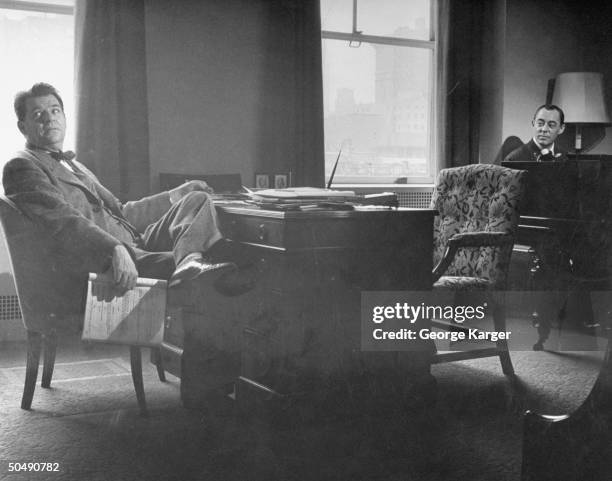 Composers Oscar Hammerstein II and Richard Rodgers sitting in their office.