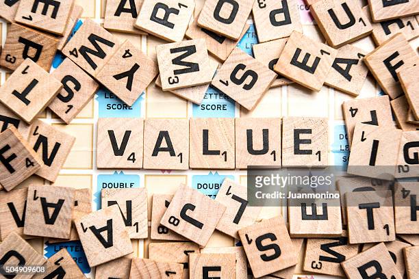 word value in scrabble letters - scrabble stock pictures, royalty-free photos & images