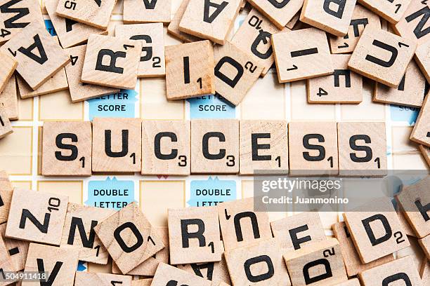 word success in scrabble letters - scrabble stock pictures, royalty-free photos & images