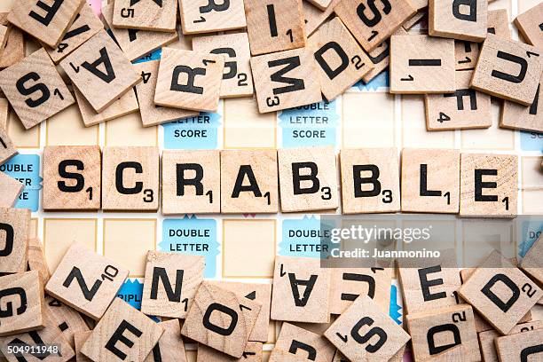 word scrabble in scrabble letters - scrabble stockfoto's en -beelden