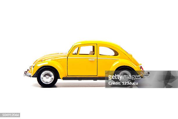 old yellow volkswagen beetle - volkswagen stock pictures, royalty-free photos & images