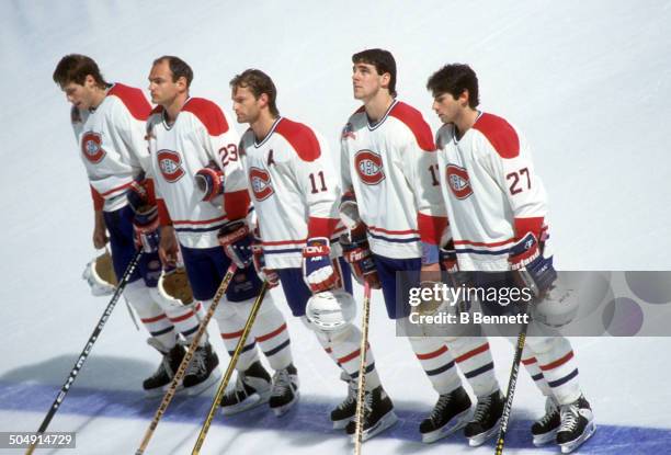 Lyle Odelein, Brian Bellows, Kirk Muller, John LeClair and Mathieu Schneider of the Montreal Canadiens stand on the blue line during the national...