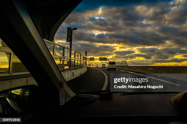 driving on the expressway under the morning sun rays - ebina city stock pictures, royalty-free photos & images