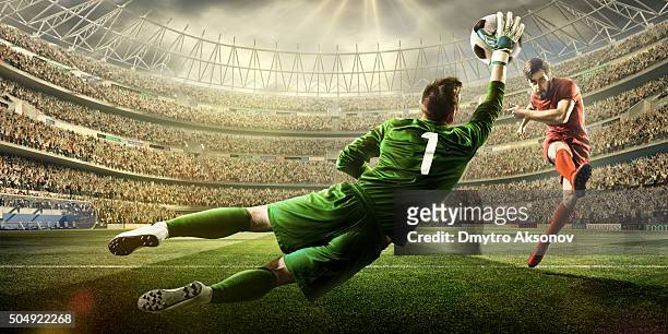 soccer game moment with goalkeeper - taking a shot sport stock pictures, royalty-free photos & images