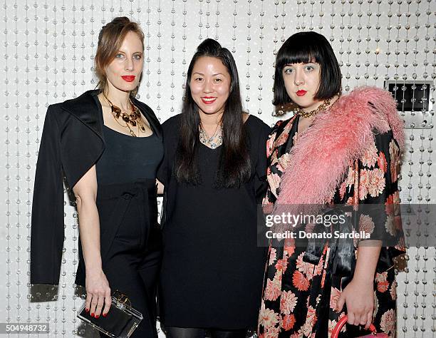 Filmmaker/artist Liz Goldwyn, designer Carol Lim, and artist Alia Penner attend the Galvan For Opening Ceremony Dinner Hosted By Swarovski at Private...