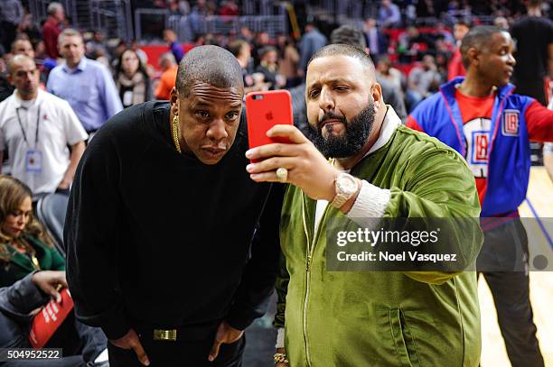 Jay Z and DJ Khaled attend a basketball game between the Miami Heat and the Los Angeles Clippers at Staples Center on January 13, 2016 in Los...