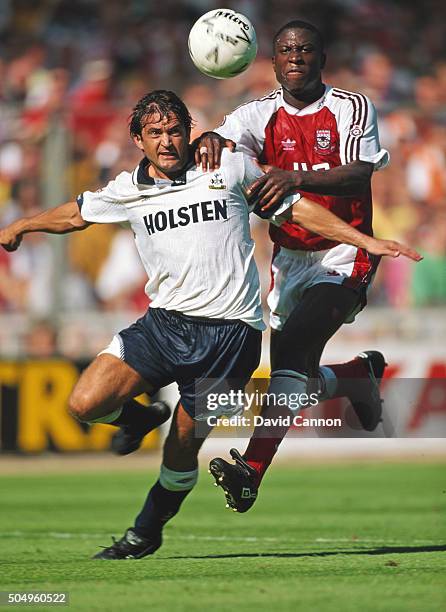 Gary Mabbutt of Tottenham Hotspur is challenged by Kevin Campbell of Arsenal during the 1991 FA Charity Shield match at Wembley Stadium on August 10,...