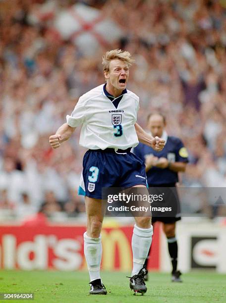 Stuart Pearce of England celebrates his penalty shoot out conversion during the 1996 European Championships Quarter Final match between England and...