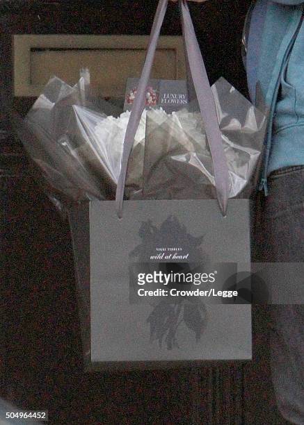Man delivers flowers at the home of Alan and Rima Rickman on January 14, 2016 in London, England.