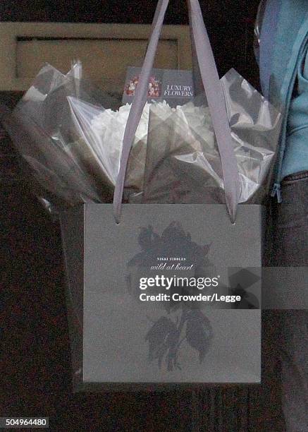 Man delivers flowers at the home of Alan and Rima Rickman on January 14, 2016 in London, England.