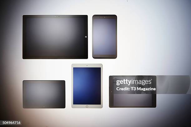 Selection of tablet computers, including a Microsoft Surface Pro 3, Tesco Hudl 2, Google Nexus 9, Apple iPad Air 2 and Amazon Kindle Fire HDX, taken...