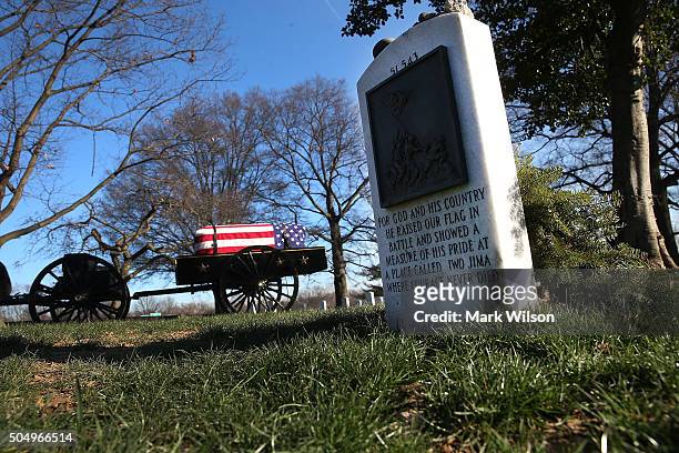 Flag drapped caisson for Tuskegee airman, Second Lt. Samuel Leftenant, rolls past the gravesite on Iwo Jima flag raiser Rene Gagnon, during a full...