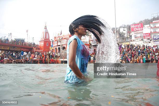 Devotee taking holy dip at Har Ki Pauri on the bank of the river Ganga on the first bath of Ardh Kumbh fair 2016 on January 14, 2016 in Haridwar,...