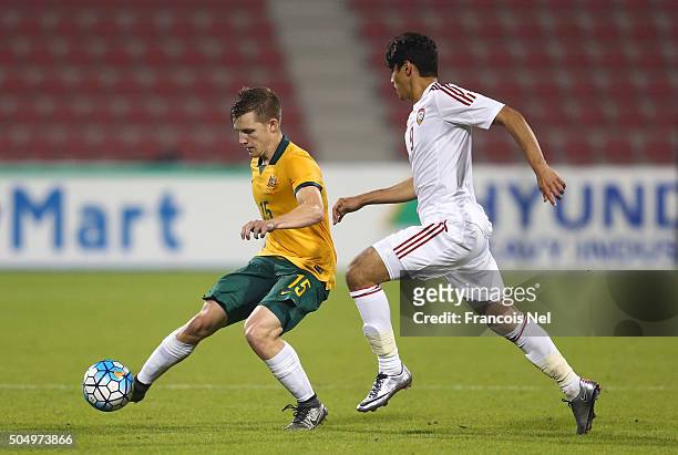 Scott Galloway of Australia is challenged by Ahmed Husain Al Hashmi of the United Arab Emirates during the AFC U-23 Championship Group D match...