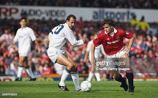 Manchester United striker Mark Hughes gets past Gary McAllister of Leeds during the Premier League match between Manchester United and Leeds United...