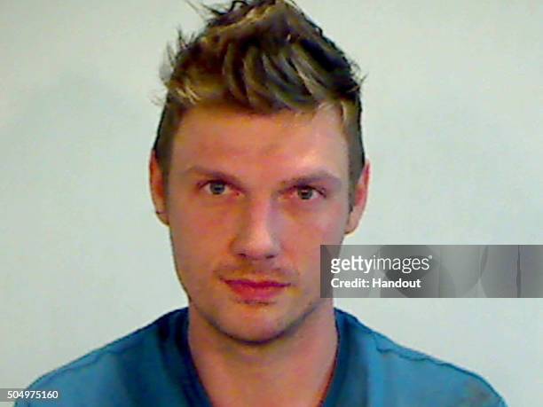 In this handout photo provided by the Key West Police Department, singer Nick Carter of the Backstreet Boys is seen in a police booking photo after...