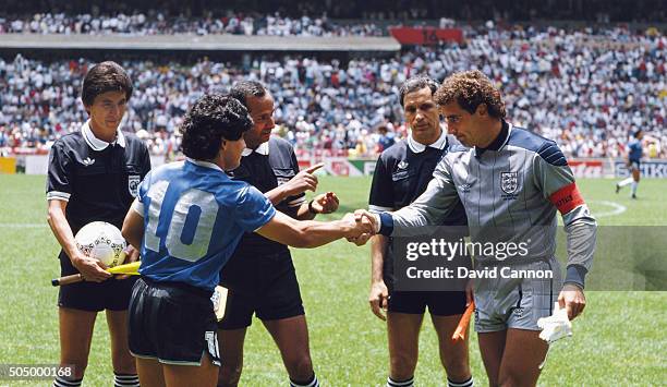 Diego Maradona of Argentina shakes hands with Peter Shilton of England under the watching eye of referee Ali Bin Nasser before the 1986 FIFA World...